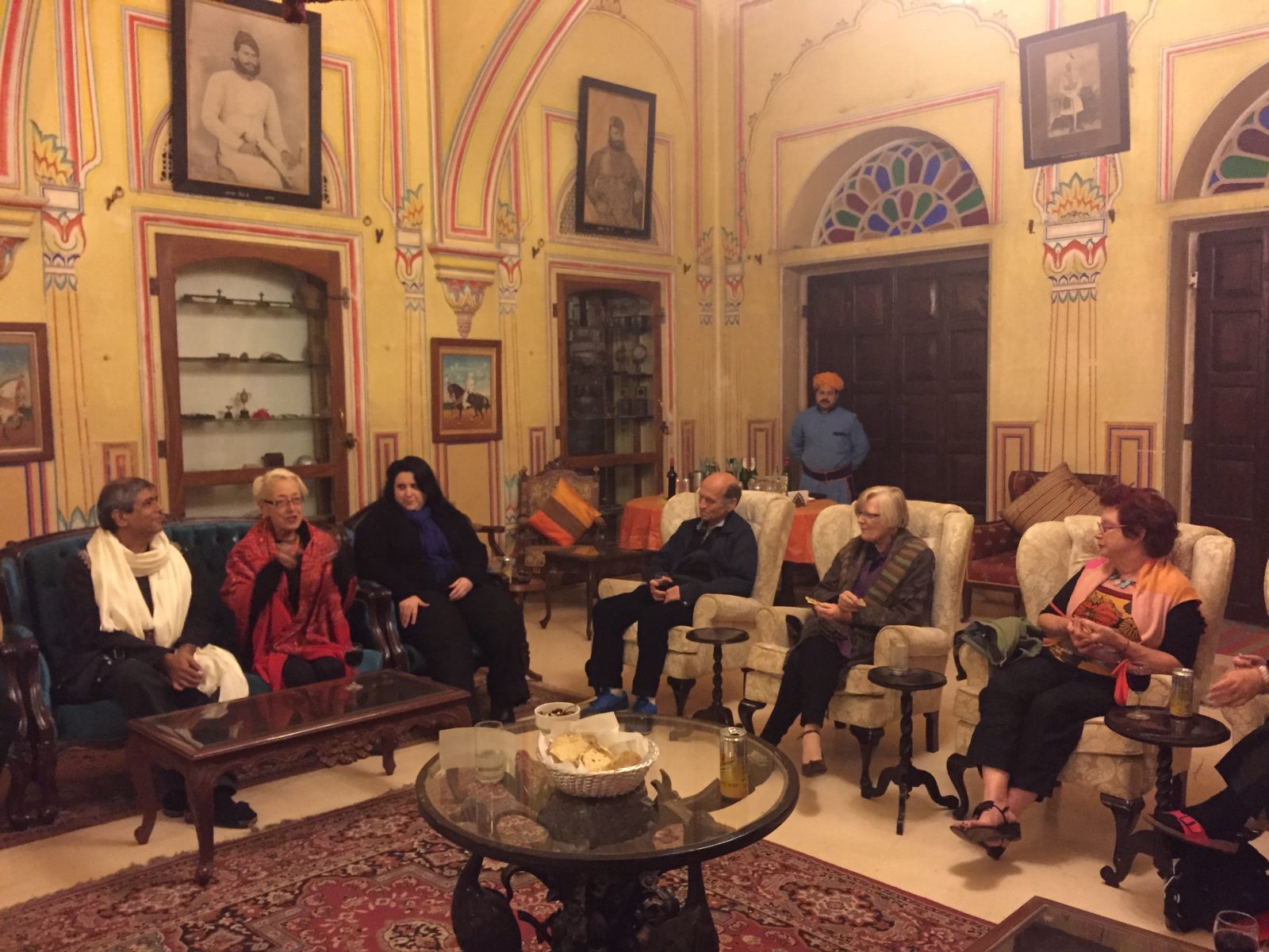 Guests gathered for the evening in the painted drawing room of a family homestay in Jaipur