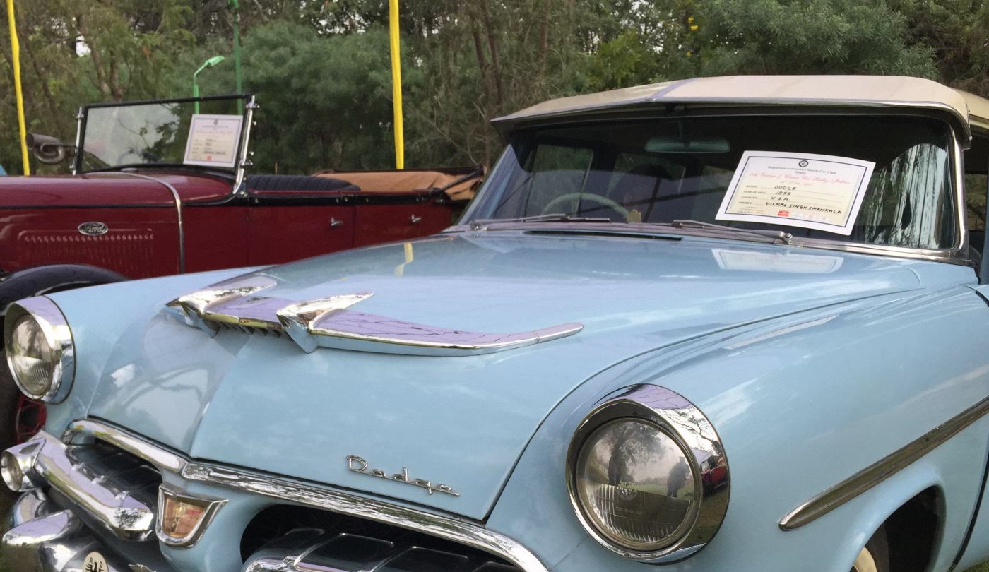 A pale blue 1956 classic car polished to a shine, ready for the vintage car drive in Jaipur