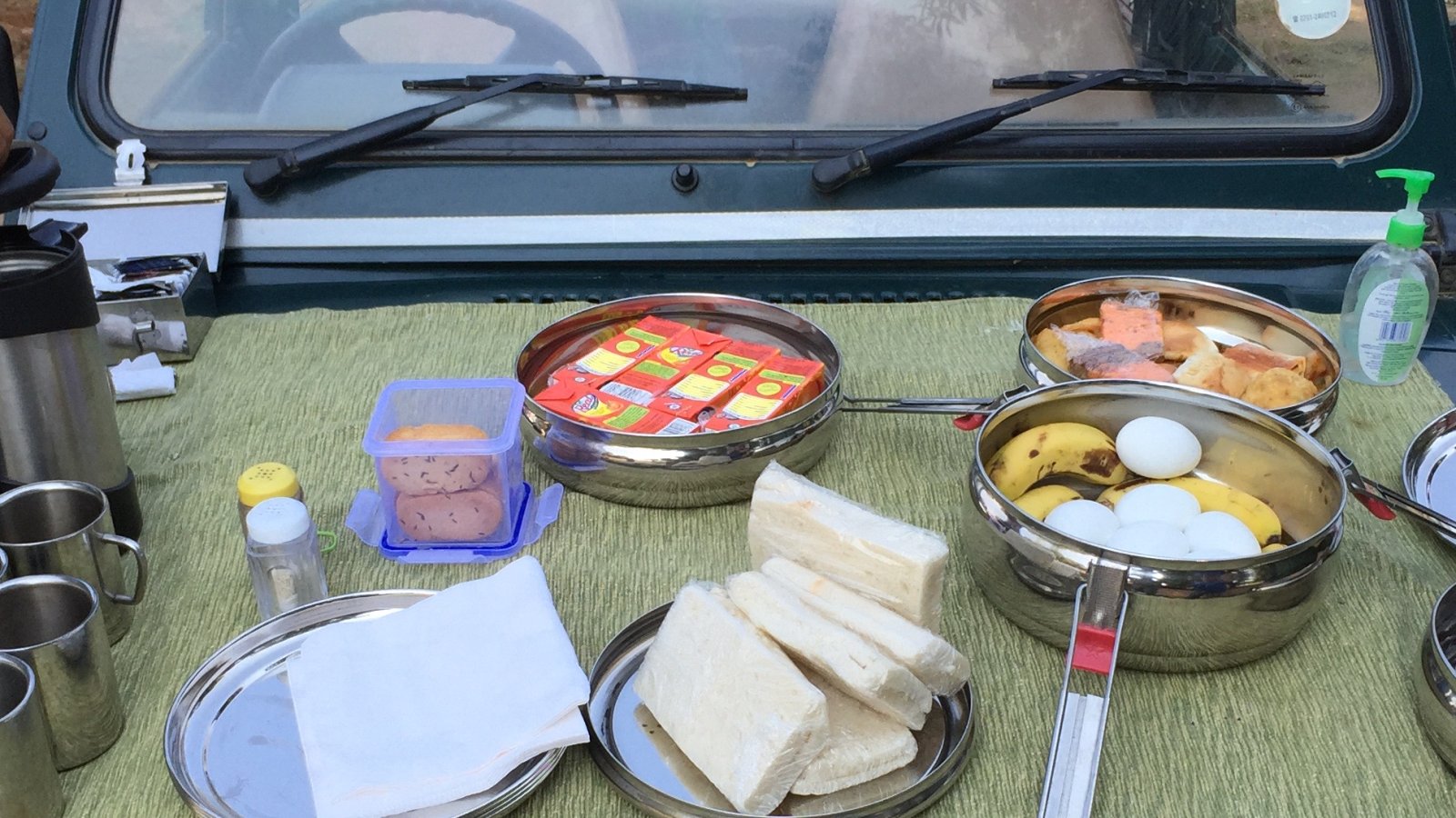 Breakfast laid out on the bonnet of the safari vehicle during a morning drive in Kanha National Park