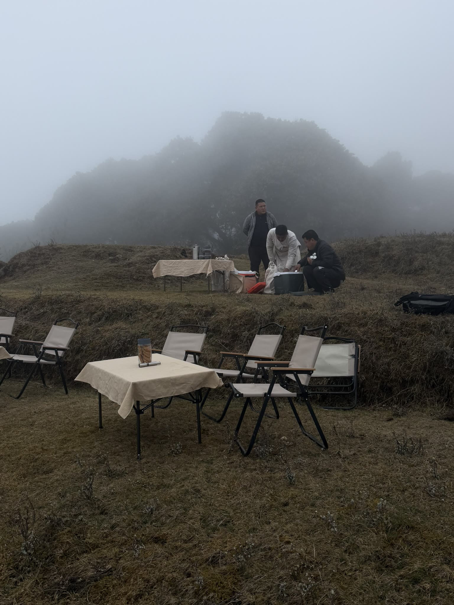 Breakfast table set out on the misty Singalila Ridge