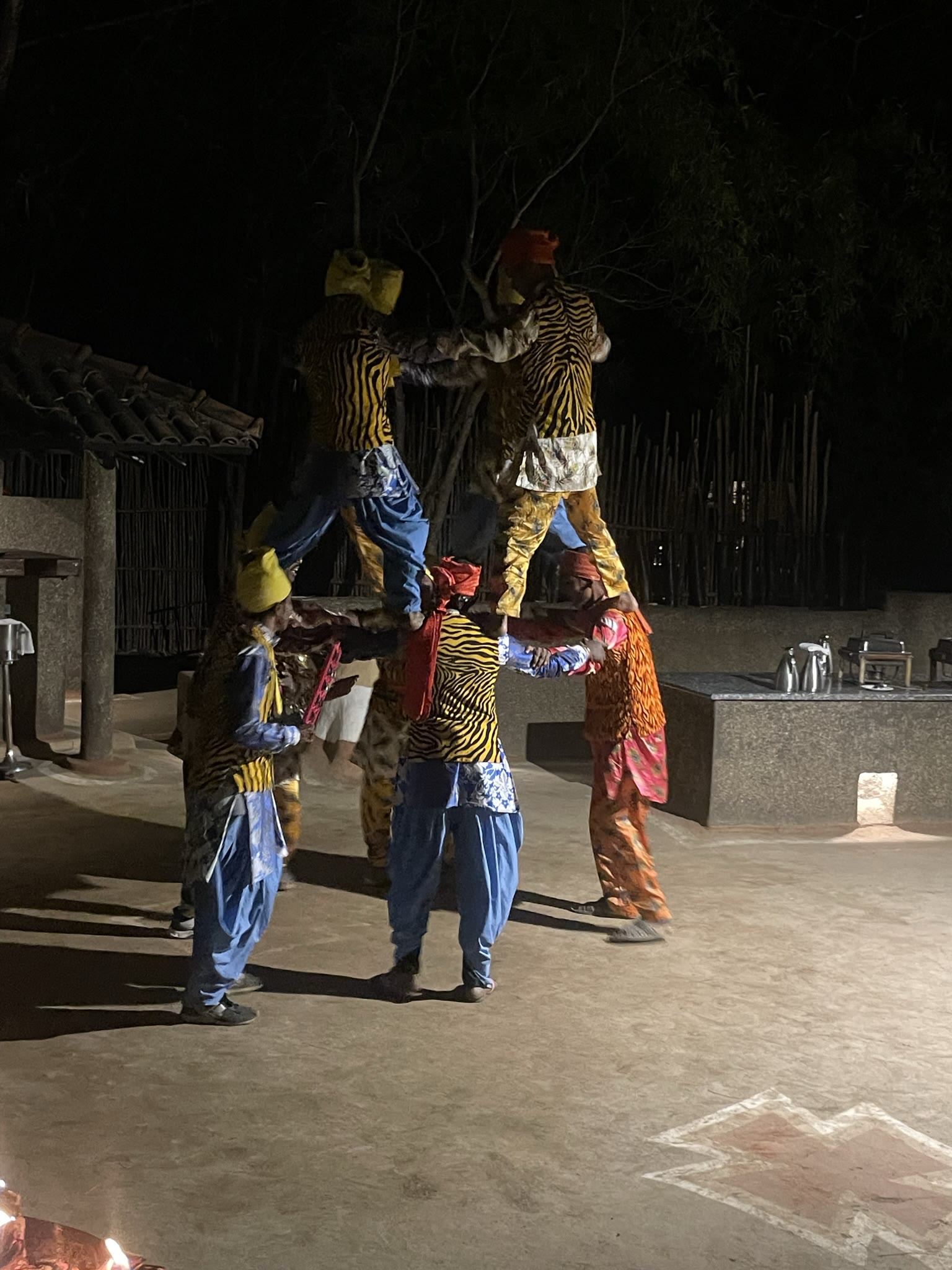 Tribal dancers forming a human pyramid during an evening performance near Bandhavgarh