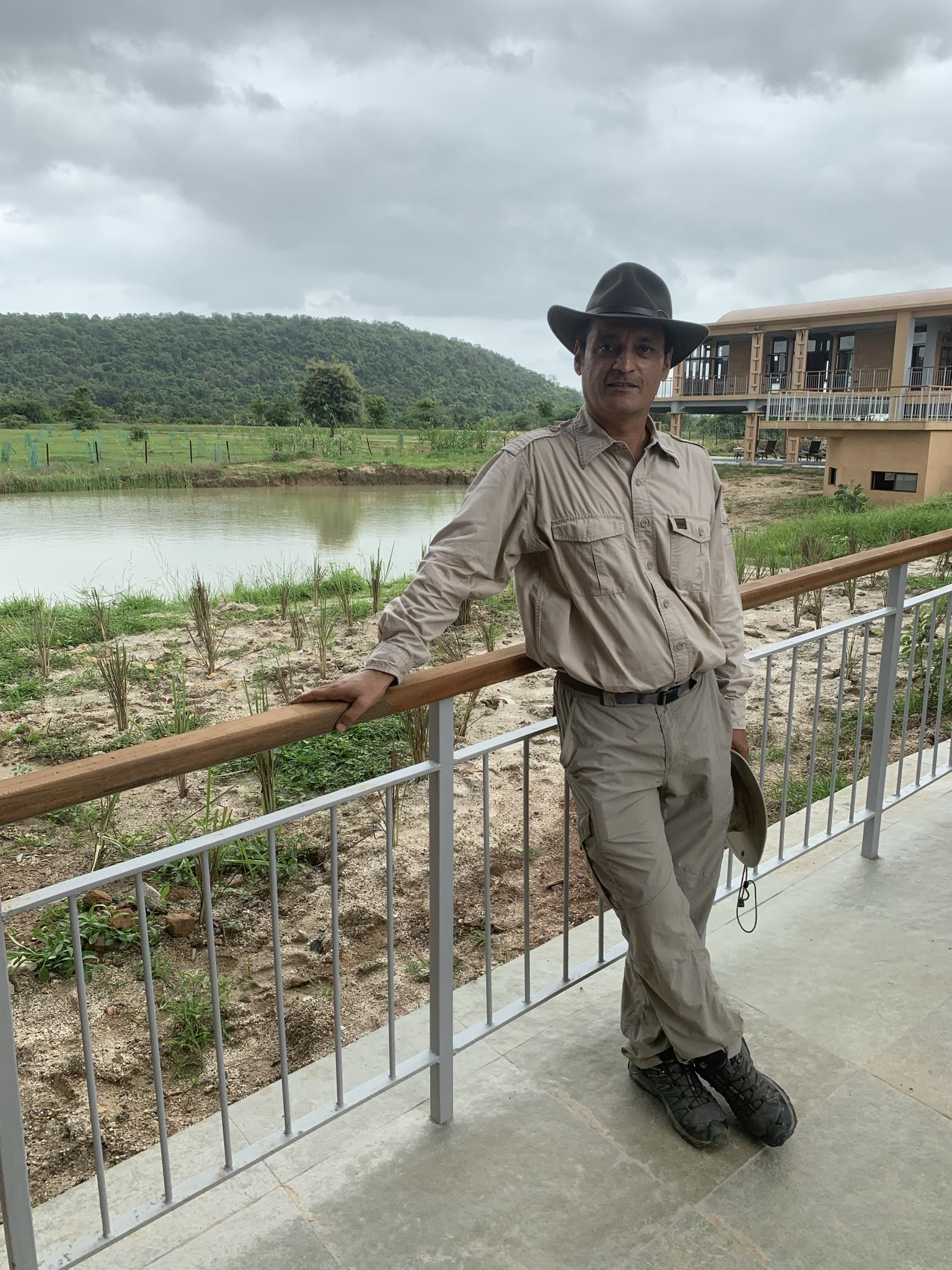 Vishal Singh, founder of India Tiger Safari, on a lodge terrace overlooking a lake