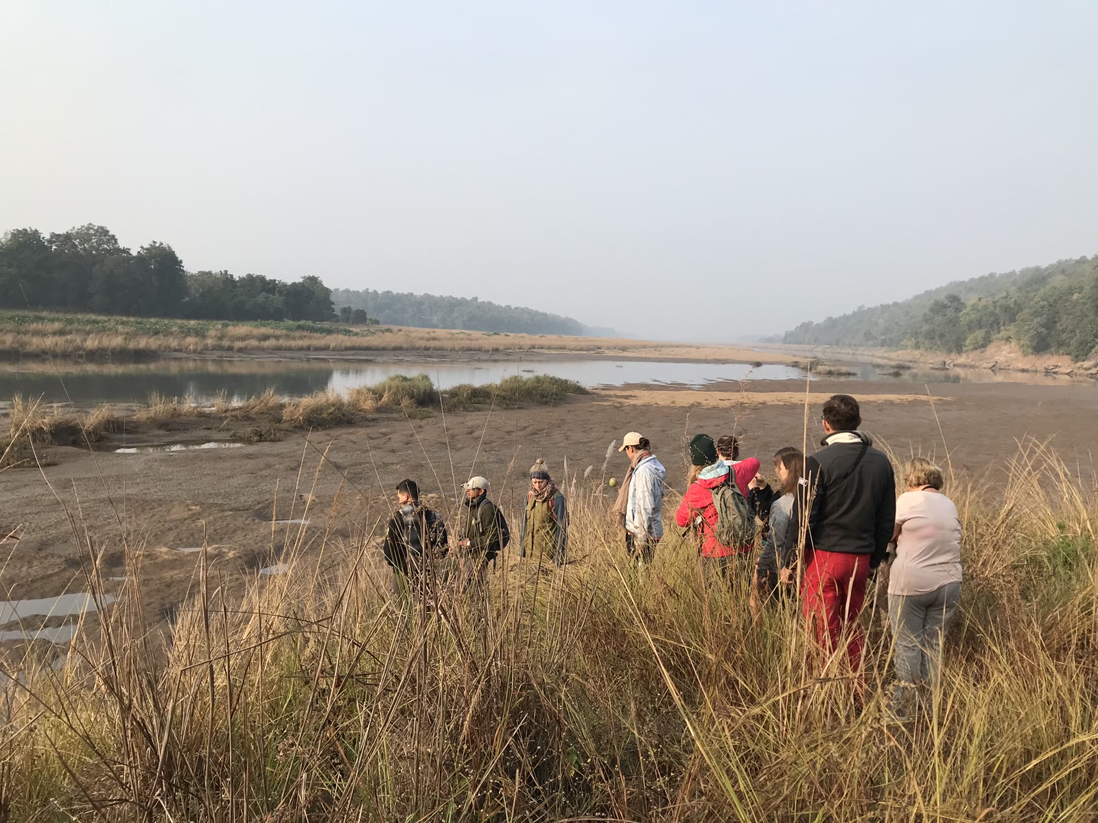 Guests on a walking safari beside the river in Satpura National Park