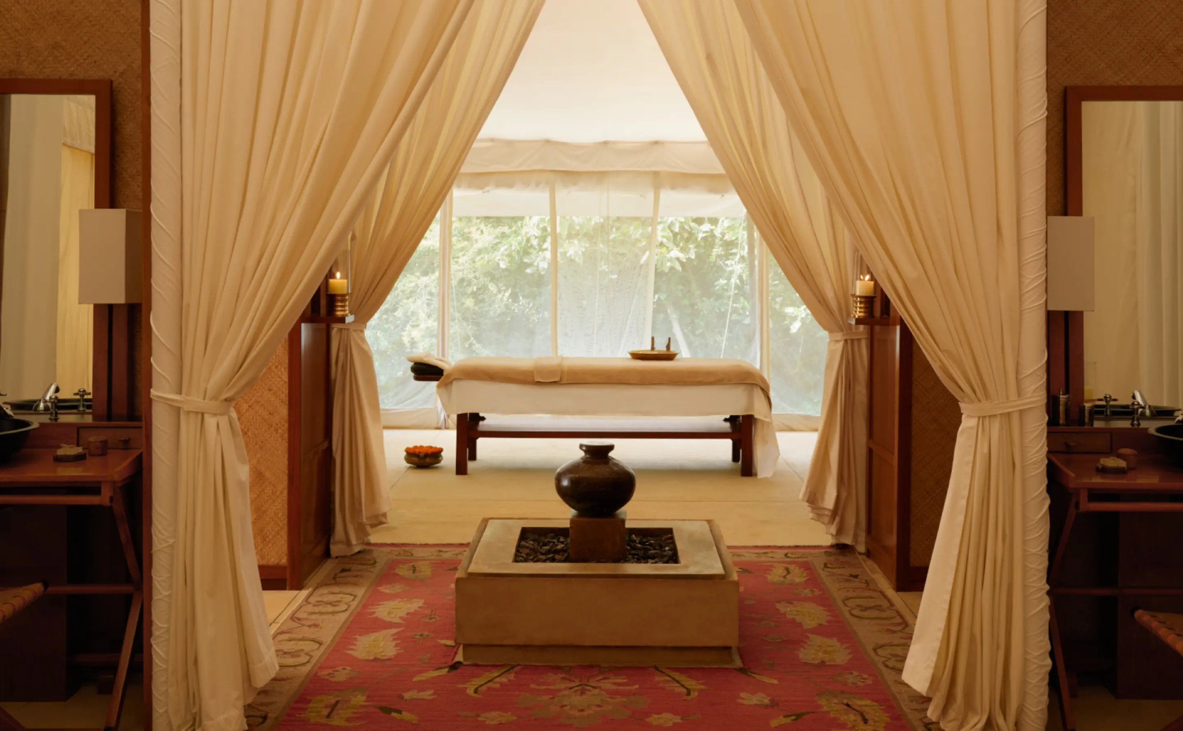 A treatment bed beyond cotton drapes at Aman-i-Khás