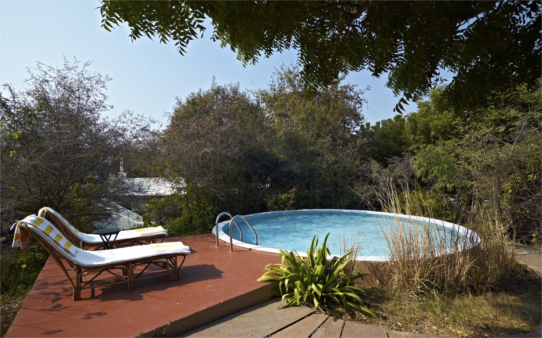 Sun loungers beside the round plunge pool at Khem Vilas