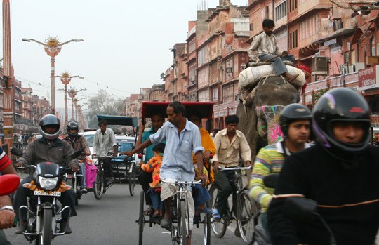 Rickshaws and motorbikes in a bazaar in Jaipur's old city