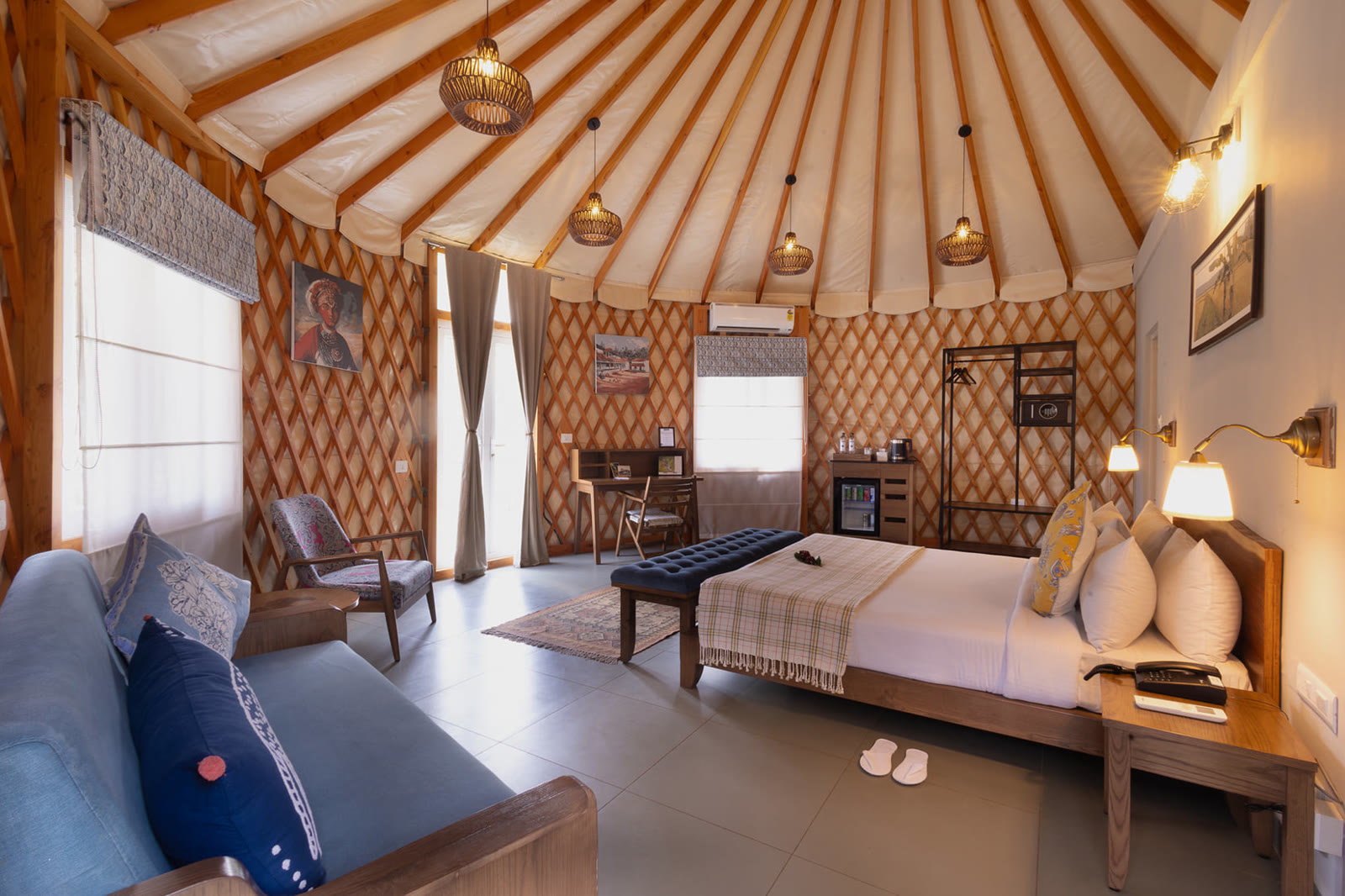 Domed room at Machaan Wilderness Lodge, with a timber-ribbed ceiling and a reading corner