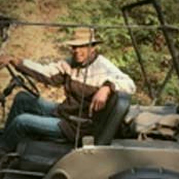 Anant Erickson at the wheel of an open safari jeep
