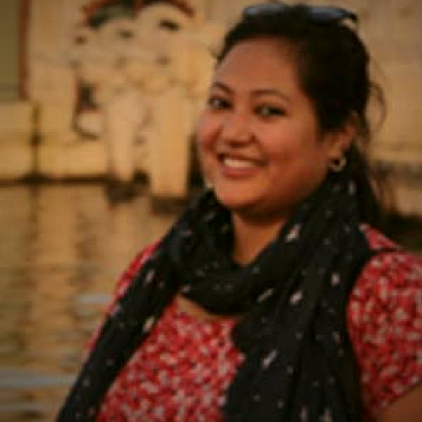 Sangita Kandel smiling beside the water