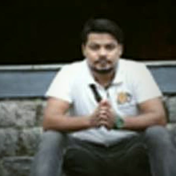 Vijendra Kuliyal seated on stone steps